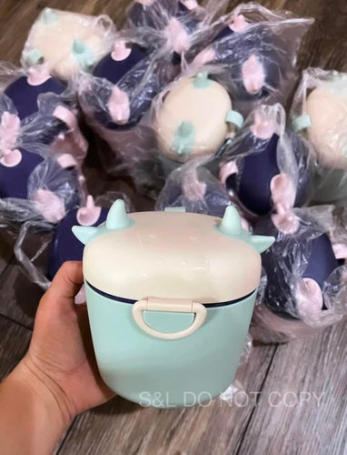 Cow Formula Containers sent at random pink/purple & cream